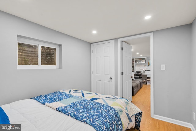 bedroom featuring recessed lighting, baseboards, and light wood-style floors