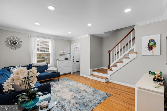 living area featuring recessed lighting, stairway, wood finished floors, and ornamental molding