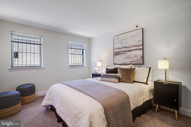 carpeted bedroom with baseboards