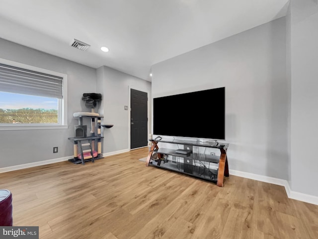 interior space featuring visible vents, recessed lighting, baseboards, and wood finished floors