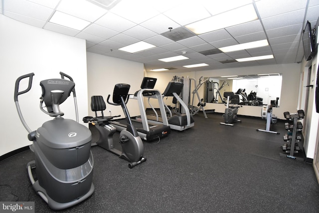 exercise room with a drop ceiling