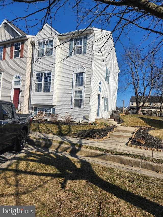 view of front of property with a front lawn