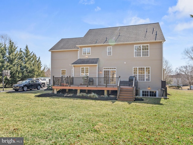 back of house with a lawn and a deck