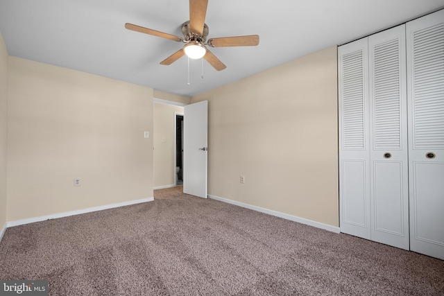 unfurnished bedroom featuring carpet flooring, baseboards, a closet, and ceiling fan