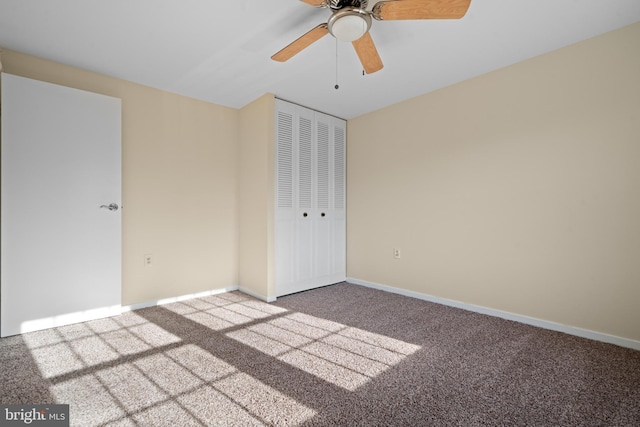 unfurnished bedroom featuring a closet, baseboards, carpet, and ceiling fan