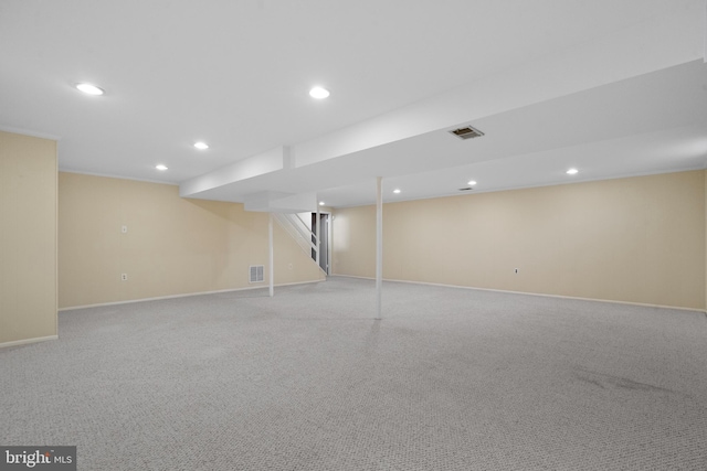 finished below grade area featuring recessed lighting, visible vents, and baseboards