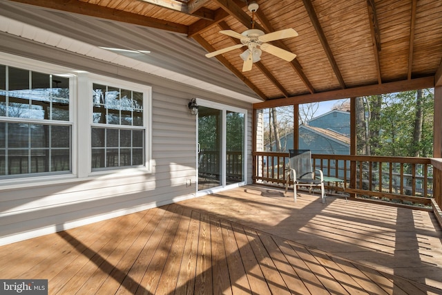 sunroom / solarium with wooden ceiling, lofted ceiling with beams, and a ceiling fan