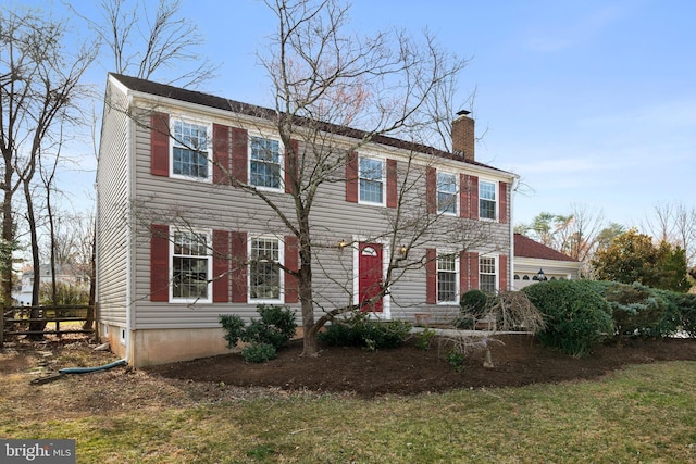 colonial inspired home with a chimney