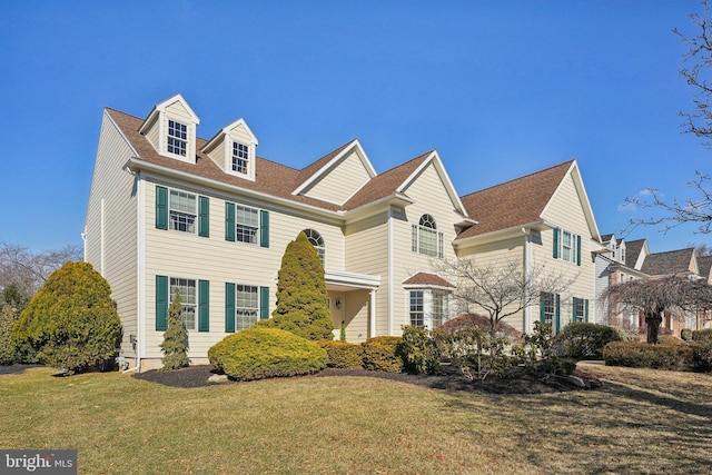 view of front of home with a front lawn