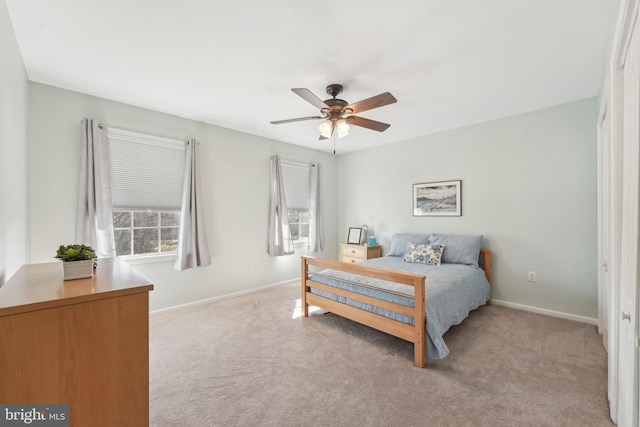 bedroom with baseboards, carpet, and a ceiling fan