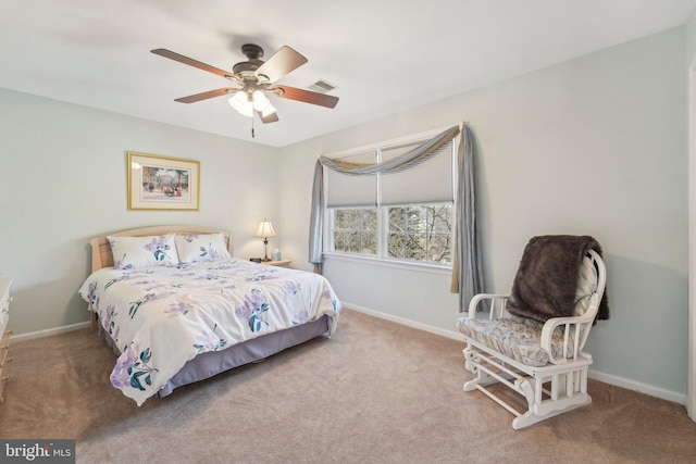 bedroom with baseboards and carpet