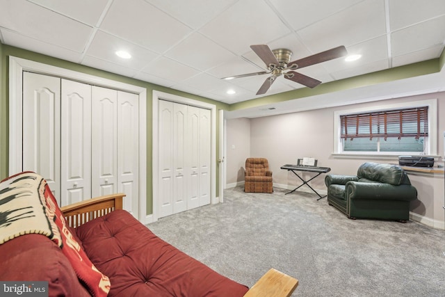 interior space with recessed lighting, a paneled ceiling, baseboards, and carpet floors