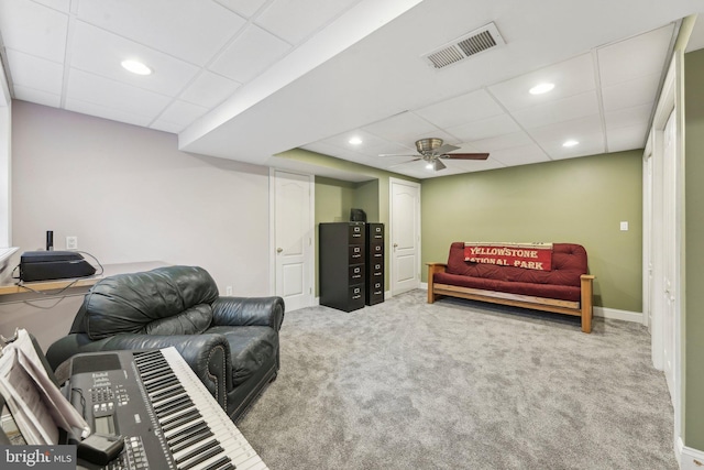 carpeted living room with recessed lighting, visible vents, a paneled ceiling, and baseboards