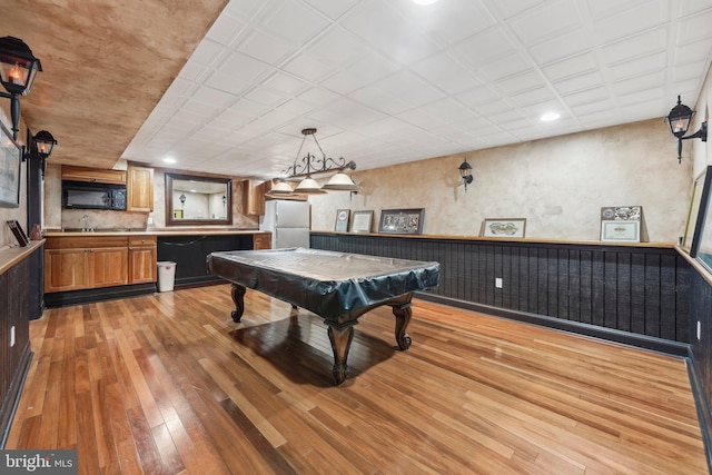 game room featuring wainscoting, light wood-type flooring, and billiards