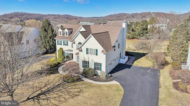 birds eye view of property with a mountain view