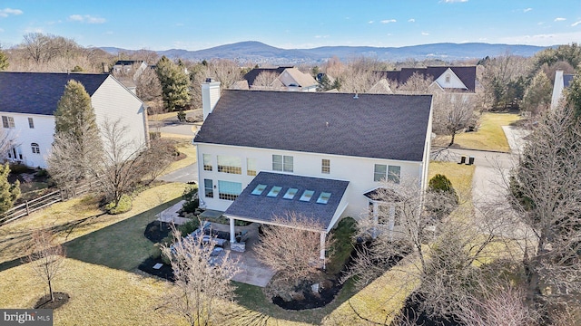 drone / aerial view featuring a mountain view