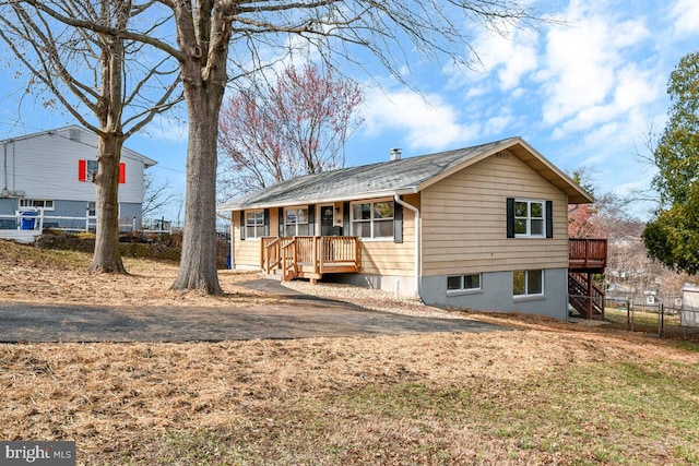 view of front of home featuring fence