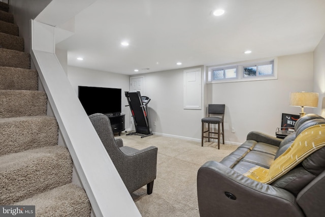 carpeted living area featuring recessed lighting, stairs, and baseboards