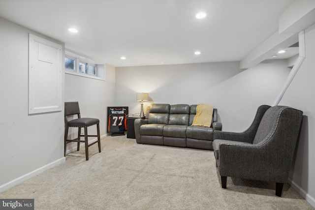 carpeted living area featuring recessed lighting and baseboards