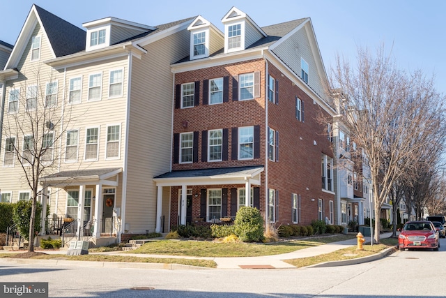 townhome / multi-family property with brick siding