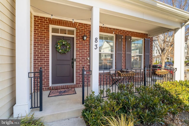 doorway to property with covered porch