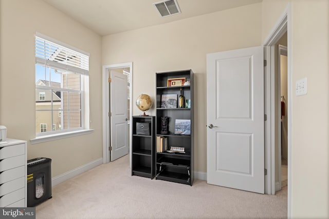 misc room with visible vents, baseboards, and carpet flooring