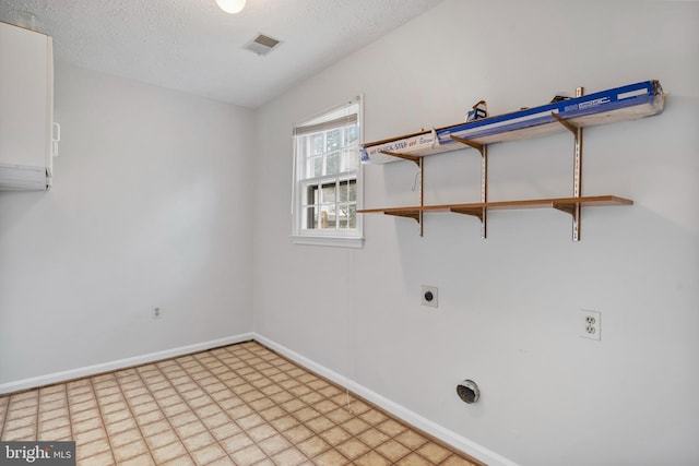 laundry room with visible vents, baseboards, laundry area, electric dryer hookup, and a textured ceiling