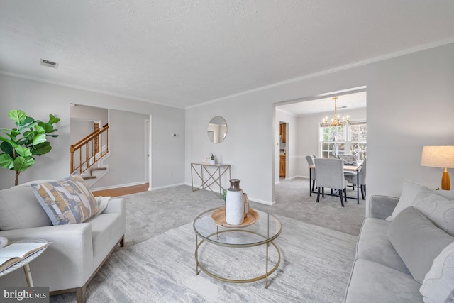 living room featuring a textured ceiling, stairway, carpet, crown molding, and a chandelier