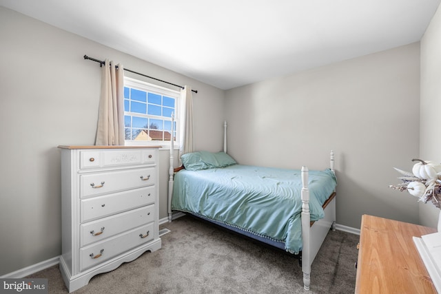 carpeted bedroom with baseboards