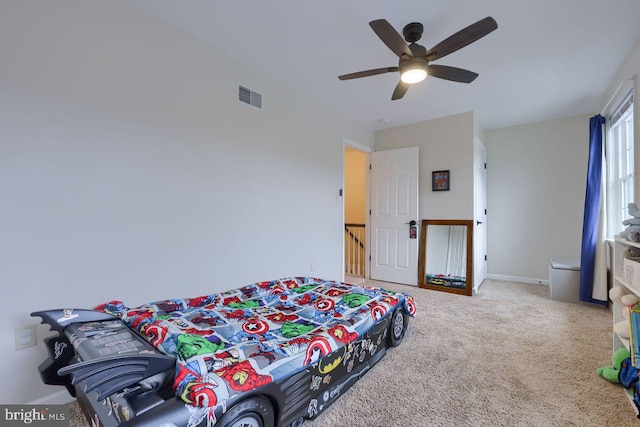 bedroom with ceiling fan, carpet, visible vents, and baseboards