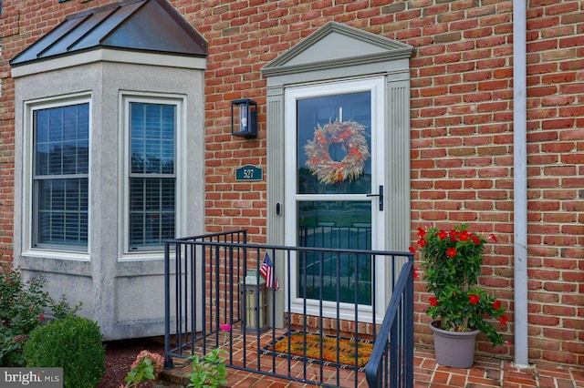 property entrance with brick siding