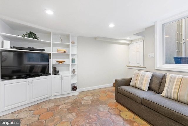 living area with recessed lighting and baseboards