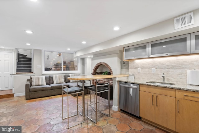 kitchen with visible vents, recessed lighting, a sink, stainless steel dishwasher, and backsplash