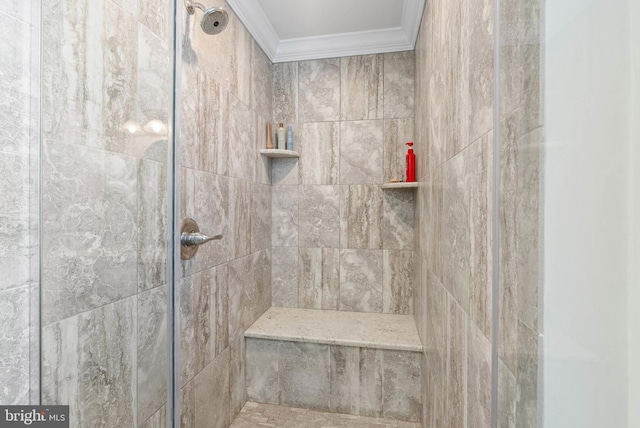 full bath with a tile shower and ornamental molding