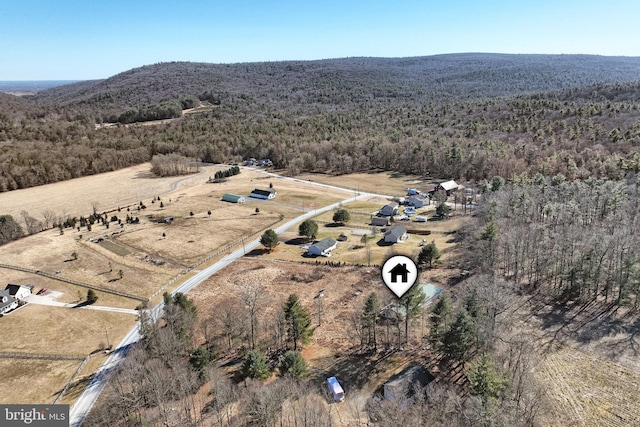 bird's eye view with a rural view and a wooded view