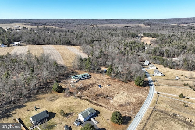 drone / aerial view with a rural view and a wooded view