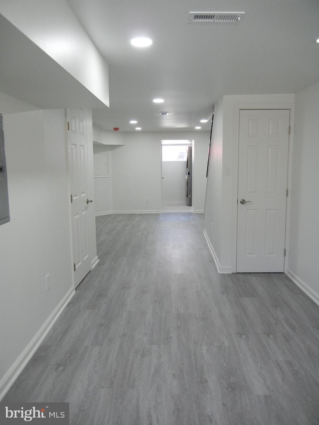 empty room with visible vents, baseboards, and wood finished floors