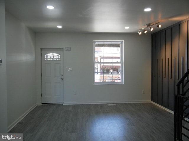 entryway with recessed lighting, baseboards, and wood finished floors