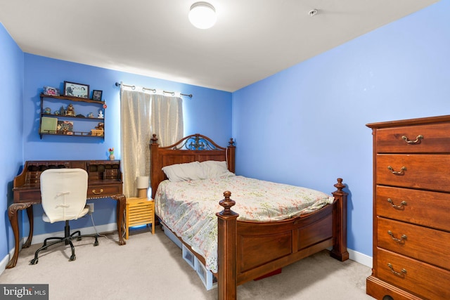 bedroom with baseboards and carpet floors