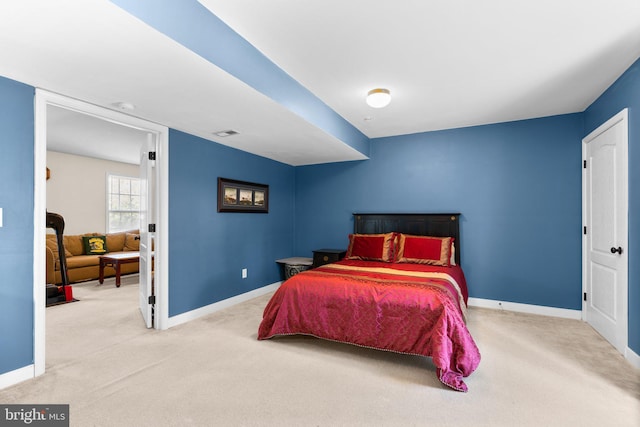 bedroom featuring visible vents, baseboards, and carpet floors