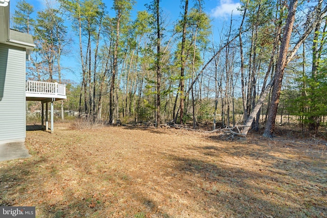 view of yard featuring a wooden deck