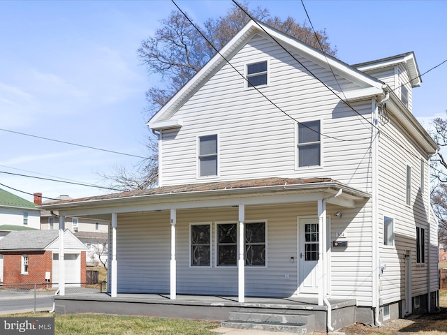 view of front of house featuring a porch and fence