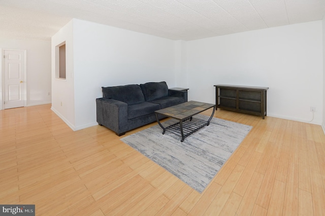 living room with wood finished floors and baseboards