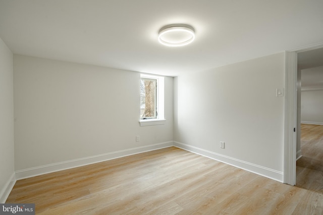 unfurnished bedroom with baseboards and light wood finished floors