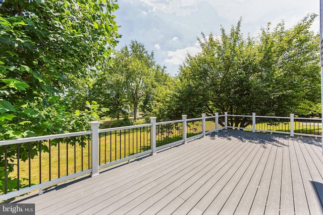 deck featuring a lawn