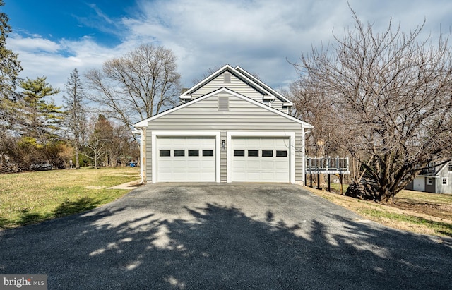 garage with aphalt driveway
