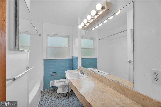 full bath with visible vents, walk in shower, toilet, a bathing tub, and tile walls