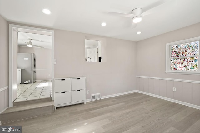 unfurnished room featuring light wood finished floors, visible vents, recessed lighting, and ceiling fan