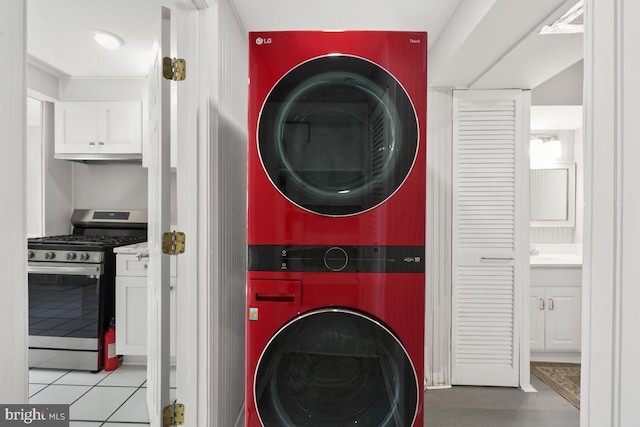 laundry room with stacked washer / drying machine and laundry area