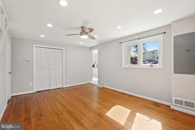 unfurnished bedroom featuring electric panel, recessed lighting, visible vents, and light wood-type flooring